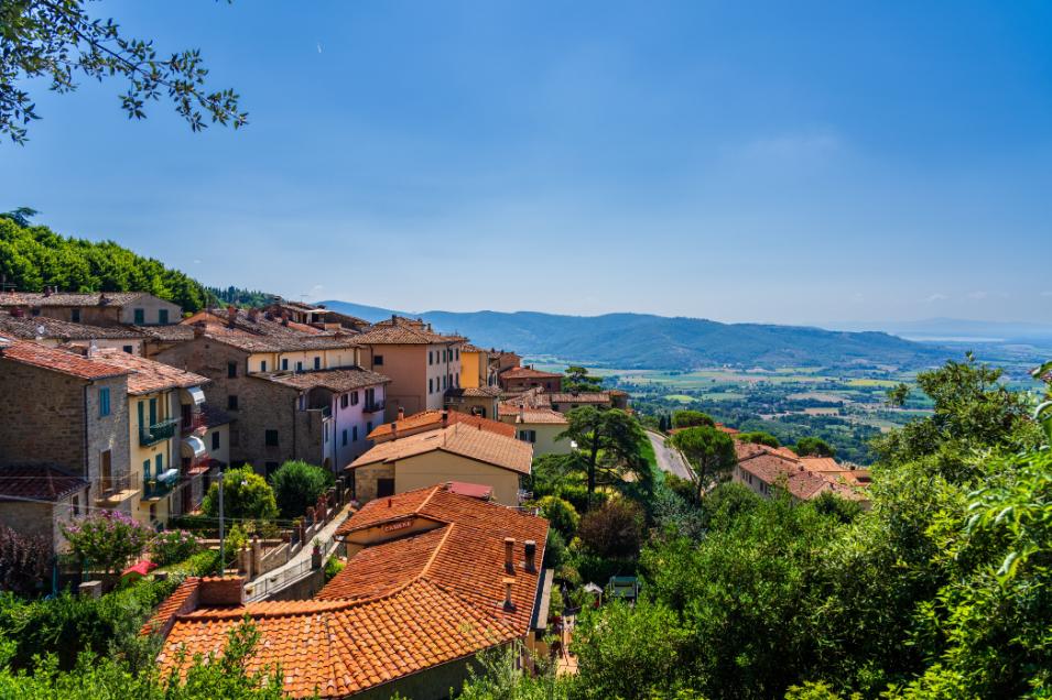 The Treasury building carved into red rock cliffs in Petra Jordan