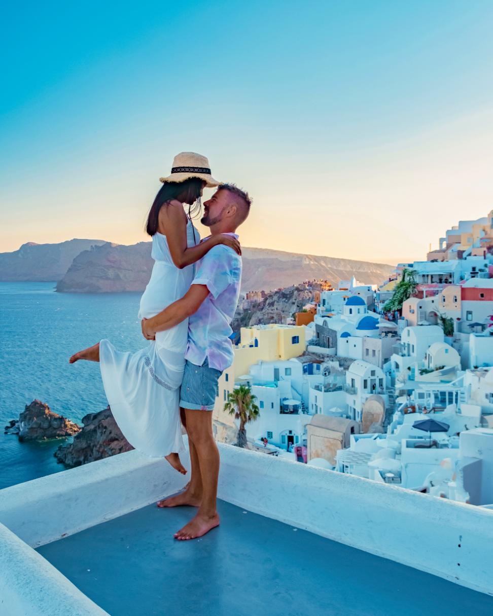 romantic sunset view in Santorini Greece overlooking the caldera
