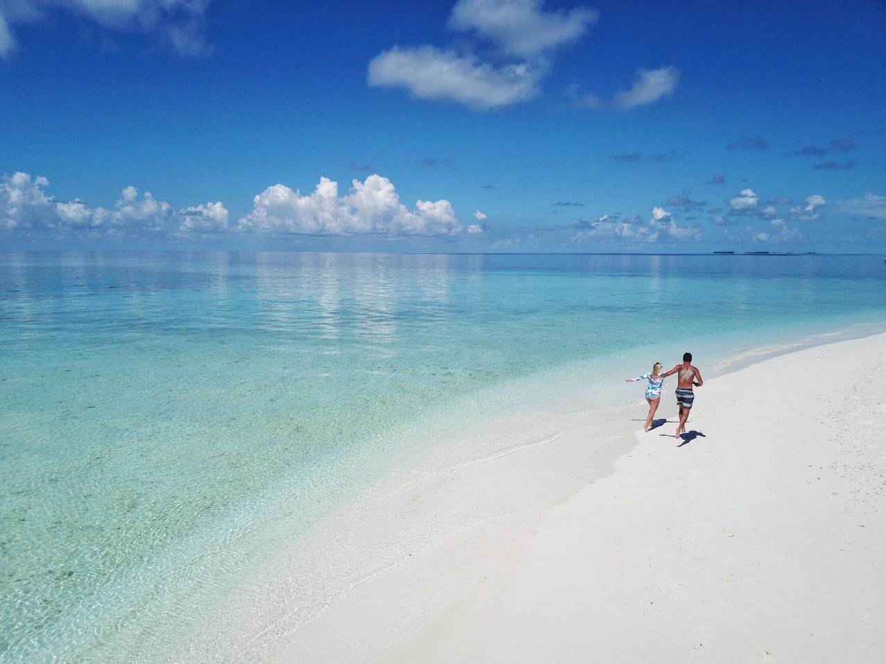 couple relaxing at luxury Maldives overwater villa