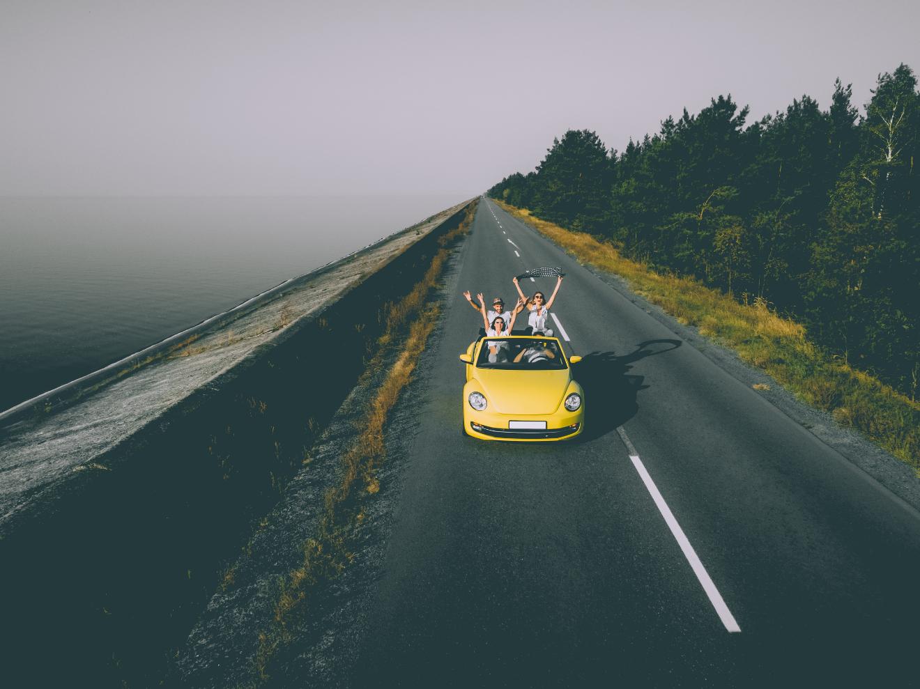Scenic countryside road through green rolling hills in Europe