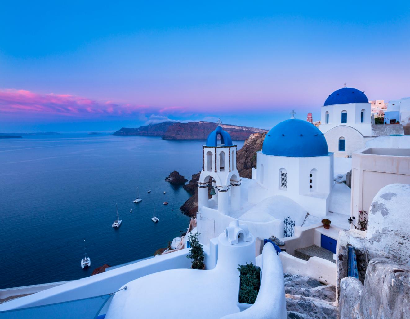 white and blue houses of Santorini cliffside village