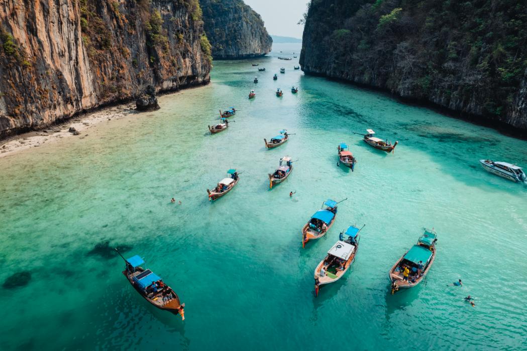 Multi-level turquoise waterfalls in Erawan National Park Thailand